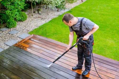 Decking being cleaned with a jet washer